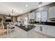 Spacious kitchen with granite countertops, island, and white cabinetry at 1125 Neva Ranch Ave, North Las Vegas, NV 89081