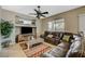 Spacious living room featuring a leather sectional sofa and large TV at 1125 Neva Ranch Ave, North Las Vegas, NV 89081