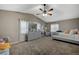 Spacious main bedroom with gray and yellow bedding and dresser at 1125 Neva Ranch Ave, North Las Vegas, NV 89081