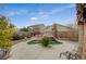 Charming kidney shaped pool with surrounding landscaping at 1125 Neva Ranch Ave, North Las Vegas, NV 89081