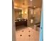 Elegant bathroom with double vanity, large shower, and tiled floors at 135 E Harmon Ave # 718, Las Vegas, NV 89109