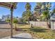 Landscaped backyard with grassy area and mature palm trees at 1702 La Cruz Dr, Henderson, NV 89014