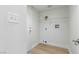 Laundry room with wire shelving and light wood floors at 1702 La Cruz Dr, Henderson, NV 89014