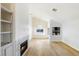 Bright living room with fireplace, built-in shelving, and hardwood floors at 1702 La Cruz Dr, Henderson, NV 89014