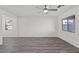 Bright living room with grey flooring and large window, offering abundant natural light at 1716 Sandia Rock Ave, North Las Vegas, NV 89032