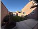 Private backyard with grassy area, patio, and shed at 1806 Discus Dr, Las Vegas, NV 89108