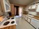 White kitchen cabinets and wood countertops, access to patio at 1806 Discus Dr, Las Vegas, NV 89108