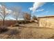 Spacious backyard with desert landscaping, block wall and beautiful blue sky at 210 Bristle Cone, Pahrump, NV 89048