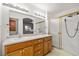 Bright bathroom with double sinks, ample counter space, and a glass enclosed shower at 210 Bristle Cone, Pahrump, NV 89048