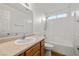 Bright bathroom featuring a single sink, a window and tub shower at 210 Bristle Cone, Pahrump, NV 89048