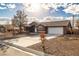 Charming single-story home featuring a two-car garage, desert landscaping, and a concrete driveway at 210 Bristle Cone, Pahrump, NV 89048