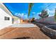 Large backyard with a patio and retaining wall at 2113 La Harve Dr, Las Vegas, NV 89106