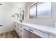 Modern bathroom with white vanity, quartz countertop, and large mirror at 2113 La Harve Dr, Las Vegas, NV 89106