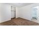 Well-lit bedroom with closet and door to bathroom at 2113 La Harve Dr, Las Vegas, NV 89106