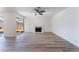 Living room with hardwood floors, fireplace and sliding door access to backyard at 2113 La Harve Dr, Las Vegas, NV 89106