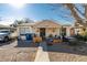 Ranch style home with a gravel front yard, covered porch, and mature tree at 2116 Poplar Ave, Las Vegas, NV 89101