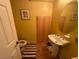 Clean bathroom with pedestal sink and tiled floors at 2273 Moresca Ave, Henderson, NV 89052