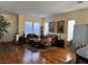 Bright living room featuring hardwood floors and ample natural light at 2273 Moresca Ave, Henderson, NV 89052