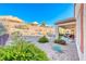 Landscaped backyard with patio and seating area at 2571 Jada Dr, Henderson, NV 89044