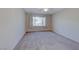 Well-lit bedroom featuring a window with hillside views at 2571 Jada Dr, Henderson, NV 89044