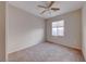 Neutral bedroom with a ceiling fan and window, creating a bright and comfortable living space at 2571 Jada Dr, Henderson, NV 89044