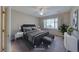 Staged bedroom with a queen-sized bed and neutral decor at 2571 Jada Dr, Henderson, NV 89044