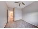 A beige bedroom with ceiling fan, large closet and open door to the rest of the home at 2571 Jada Dr, Henderson, NV 89044