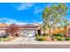 House exterior featuring a front yard and attached garage at 2571 Jada Dr, Henderson, NV 89044