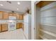 Spacious kitchen layout with white appliances and a walk-in pantry at 2571 Jada Dr, Henderson, NV 89044