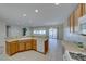 Open kitchen featuring bright cabinetry, an extended counter area, and seamless flow to the living area at 2571 Jada Dr, Henderson, NV 89044