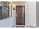 Condo building entryway with dark brown door and address number at 2615 W Gary Ave # 1069, Las Vegas, NV 89123