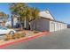 Building exterior showcasing attached garages and landscaping at 2615 W Gary Ave # 1069, Las Vegas, NV 89123