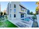 Modern home backyard featuring a sleek pool, lounge chairs, and well-manicured landscaping at 2680 Mystere Ct, Las Vegas, NV 89117