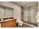 Modern bathroom features a large glass shower, sleek vanity, and stylish lighting at 2680 Mystere Ct, Las Vegas, NV 89117