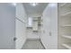 Walk in closet featuring extensive shelving and storage at 2680 Mystere Ct, Las Vegas, NV 89117