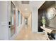 Hallway with modern design, featuring a decorative mirror and console table at 2680 Mystere Ct, Las Vegas, NV 89117