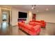 Modern loft features recessed lighting, ceiling fan, and comfortable red couches at 2680 Mystere Ct, Las Vegas, NV 89117