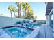 Backyard pool and spa featuring modern design and privacy landscaping at 2680 Mystere Ct, Las Vegas, NV 89117