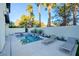 Backyard pool area featuring lounge chairs and privacy landscaping on a sunny day at 2680 Mystere Ct, Las Vegas, NV 89117