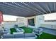 Expansive rooftop terrace featuring a fire pit, comfortable seating, and shade structure at 2680 Mystere Ct, Las Vegas, NV 89117