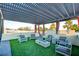 Serene rooftop patio with lush greenery, cozy seating, and a modern fire feature at 2680 Mystere Ct, Las Vegas, NV 89117