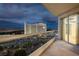 Balcony with evening city views and luxury resort view at 2857 Paradise Rd # 1901, Las Vegas, NV 89109