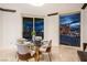 Bright dining area with city views at night, featuring a glass table and chairs at 2857 Paradise Rd # 1901, Las Vegas, NV 89109