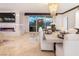 Modern dining room with city views and fireplace in the background at 2857 Paradise Rd # 1901, Las Vegas, NV 89109