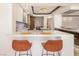 Modern kitchen island with seating for two and white countertops at 2857 Paradise Rd # 1901, Las Vegas, NV 89109