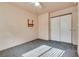 Bedroom featuring gray carpet, closet, ceiling fan, and wall mount at 2935 Kensington St, Las Vegas, NV 89156