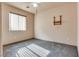 Bedroom features gray carpet, window, ceiling fan, and wall mount at 2935 Kensington St, Las Vegas, NV 89156