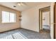 This bedroom has gray carpeting, built-in shelving, and natural light at 2935 Kensington St, Las Vegas, NV 89156