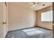 This bedroom features neutral walls, gray carpeting, and a ceiling fan at 2935 Kensington St, Las Vegas, NV 89156