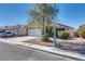 Quaint single-story home with a well-maintained front yard and a two-car attached garage at 2935 Kensington St, Las Vegas, NV 89156